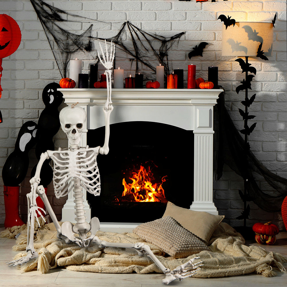 Life-size 5.4 ft Halloween skeleton decoration with movable joints, perfect for indoor or outdoor spooky displays.