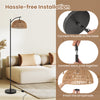 Arc floor lamp with a black pole and woven lampshade, showcasing hassle-free installation for living room decor.