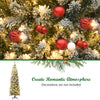 Snow flocked branches of a 7.5 feet pre-lit pencil Christmas tree with 350 warm LED lights for festive decor.