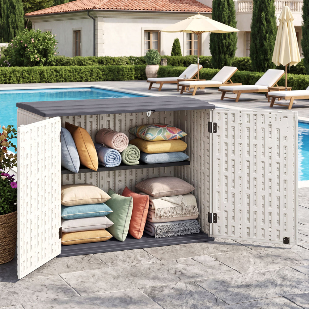 Horizontal resin storage shed with adjustable shelf, showcasing organized cushions, ideal for outdoor patio use.