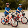 Two kids riding 20-inch red bikes with adjustable seats, kickstands, and storage baskets for ages 8 and up.