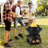 Black 20-inch patio fire pit with pot holder, used for camping and BBQ, featuring efficient air circulation and sturdy.