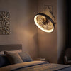 Wall mounted 20” fan in black with dimmable LED light, adjustable angle, and remote control for versatile airflow.
