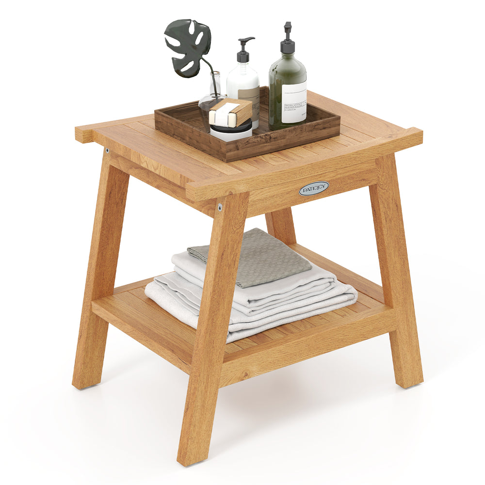 Teak wood shower bench with storage shelf, slatted design, and adjustable foot pads for stability and comfort.
