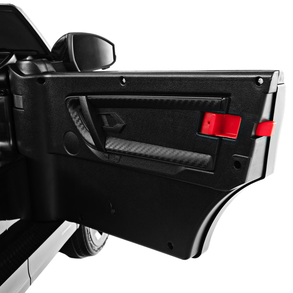 Close-up of the lockable door of a black 12V kids ride-on car, featuring realistic design and safety features.