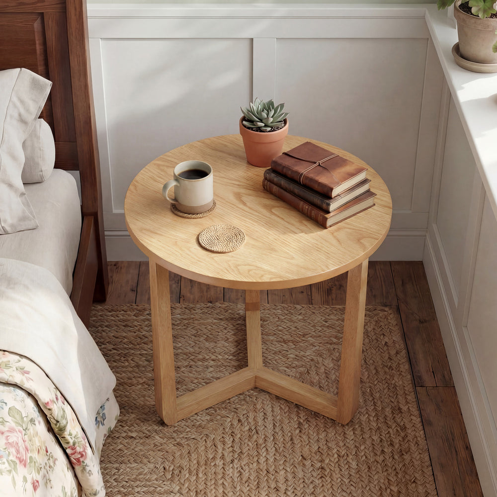 Round side table with sturdy rubber wood legs, featuring a natural finish, perfect for rustic farmhouse interiors.