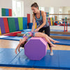 Octagon tumbling mat in pink, 22.5" x 26", supports gymnastic skills and balance training in a gym setting.