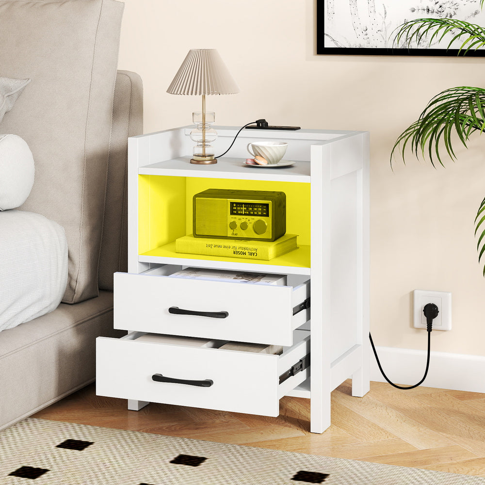 White nightstand with charging station, open shelf, and two drawers, featuring ambient LED lighting for a modern touch.