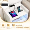 23.5-inch white nightstand with built-in charging station, open storage shelf, and LED lighting for modern decor.
