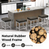 Set of 2 black and white saddle stools with cushioned seats and solid rubberwood frame for counter height use.