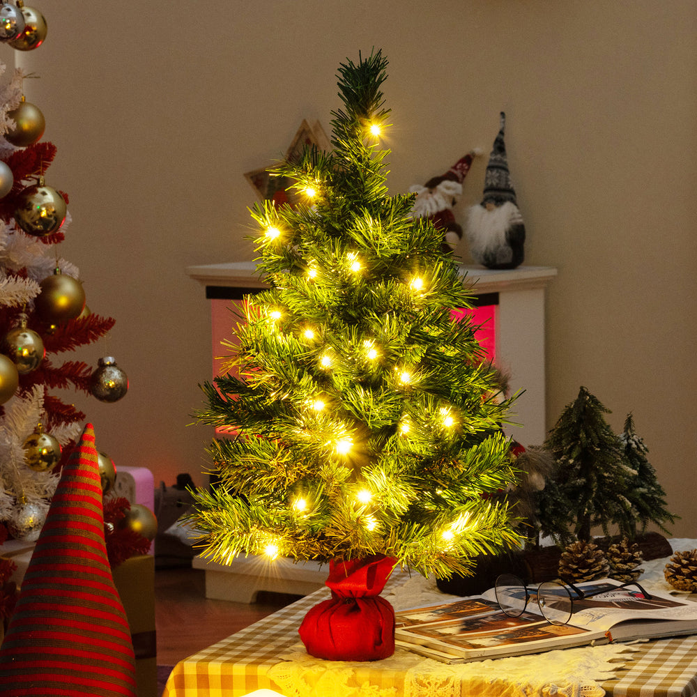 24-inch mini pre-lit Christmas tree with warm white LED lights, adding festive cheer to any tabletop setting.