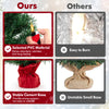 24-inch mini pre-lit Christmas tree with warm white LED lights and stable cement base wrapped in red cloth for festive.