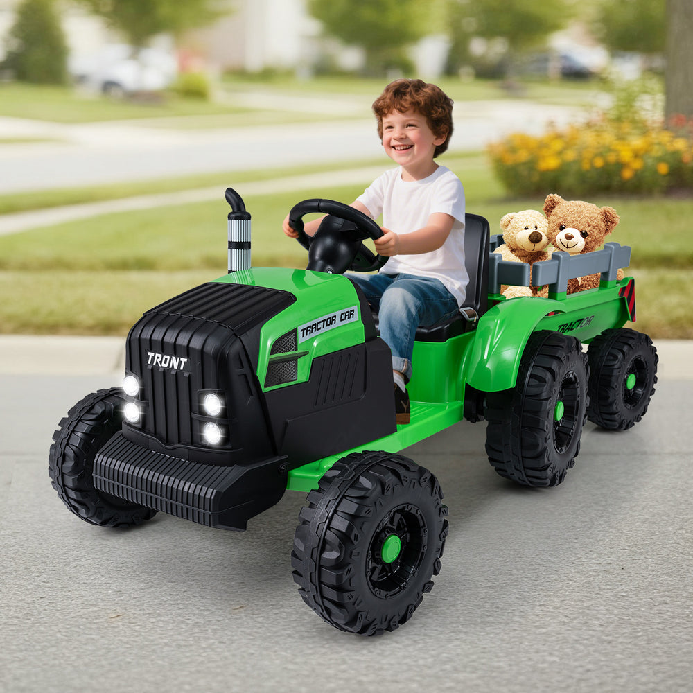 Green 24V ride-on tractor for kids with detachable trailer, remote control, and LED headlights for outdoor fun.