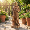 St. Francis statue with bird feeder, rustic brown, made from magnesium oxide, perfect for garden decor or remembrance.