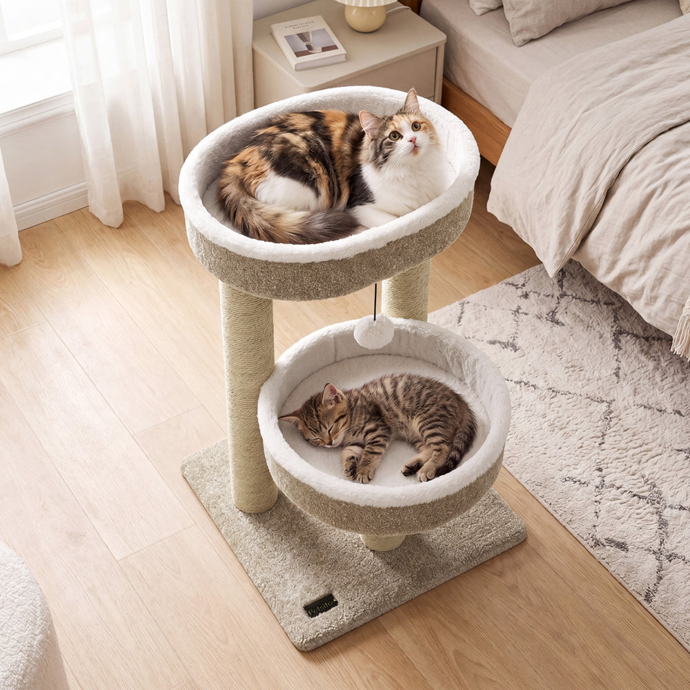 Cat tower with two plush perches in beige, featuring scratching posts and a dangling ball for playful relaxation.
