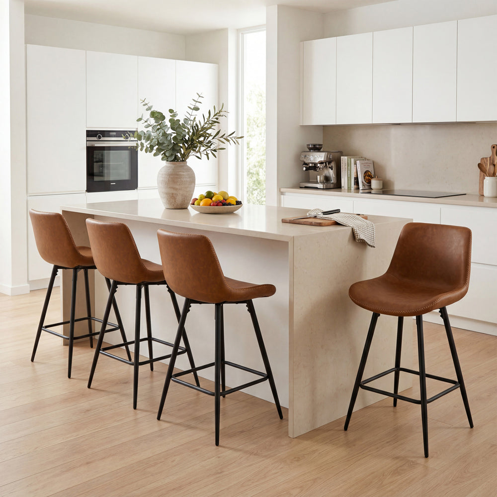 Brown 24-inch bar stools with backs and footrests arranged at a kitchen island in a modern setting.