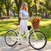 24-inch beige beach cruiser bike featuring a woven basket, cup holder, and adjustable handlebars for comfortable riding.