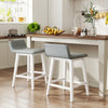 Set of 2 white 24-inch counter height bar stools with low back and faux linen fabric, ideal for kitchen islands.
