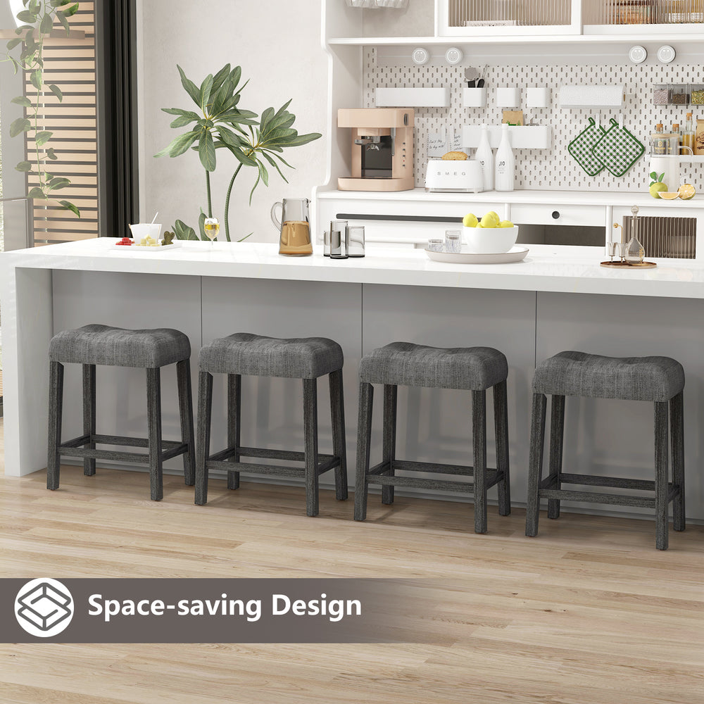 Set of 2 gray saddle bar stools with padded seats, featuring a space-saving design for easy under-counter storage.