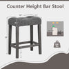 Gray 24-inch counter height bar stool with padded saddle seat, button-tufted design, and solid rubber wood frame.