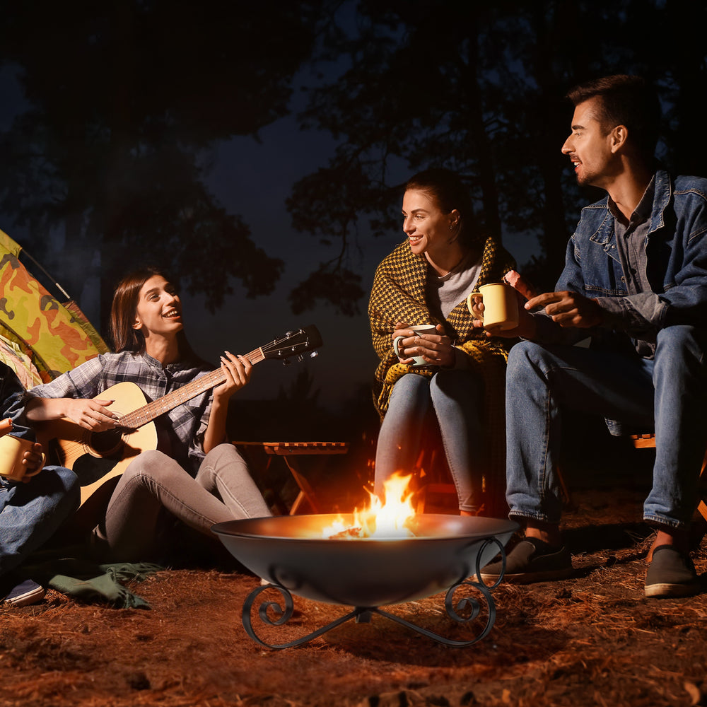 24-inch heavy-duty metal fire pit bowl with handles, perfect for cozy outdoor gatherings and bonfires with friends.