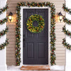 The 24" pre-lit Christmas wreath features 50 warm white LED lights and natural pine cones for festive door decor.