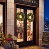 Pre-lit 24"/60 cm Christmas wreath with 50 LED lights, natural pine cones, and lush green branches for festive decor.