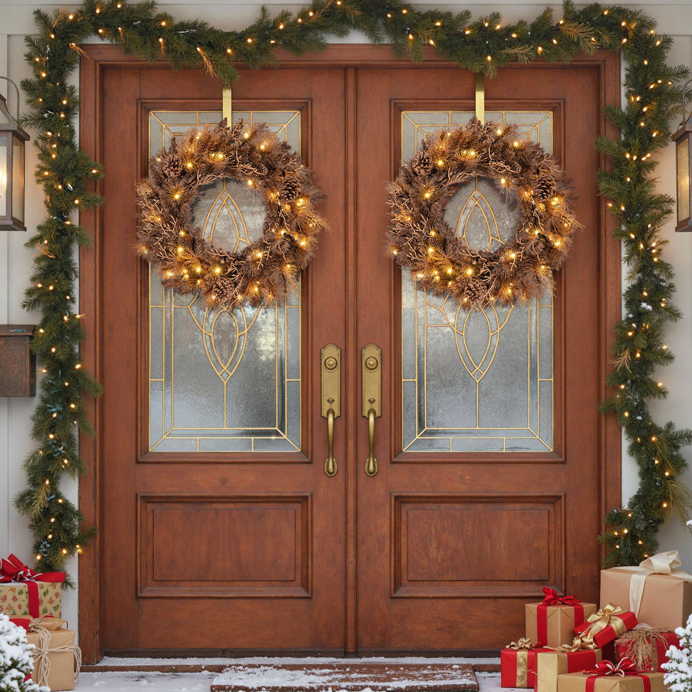 24-inch pre-lit Christmas wreath with 105 branch tips and 35 warm white LED lights, perfect for festive door decor.