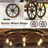 Decorative wooden wagon wheel in carbonized fir wood, 24-inch diameter, perfect for rustic wall decor.