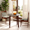 Round dining table with marble-textured veneer and rubber wood legs, ideal for dining or working in a stylish setting.