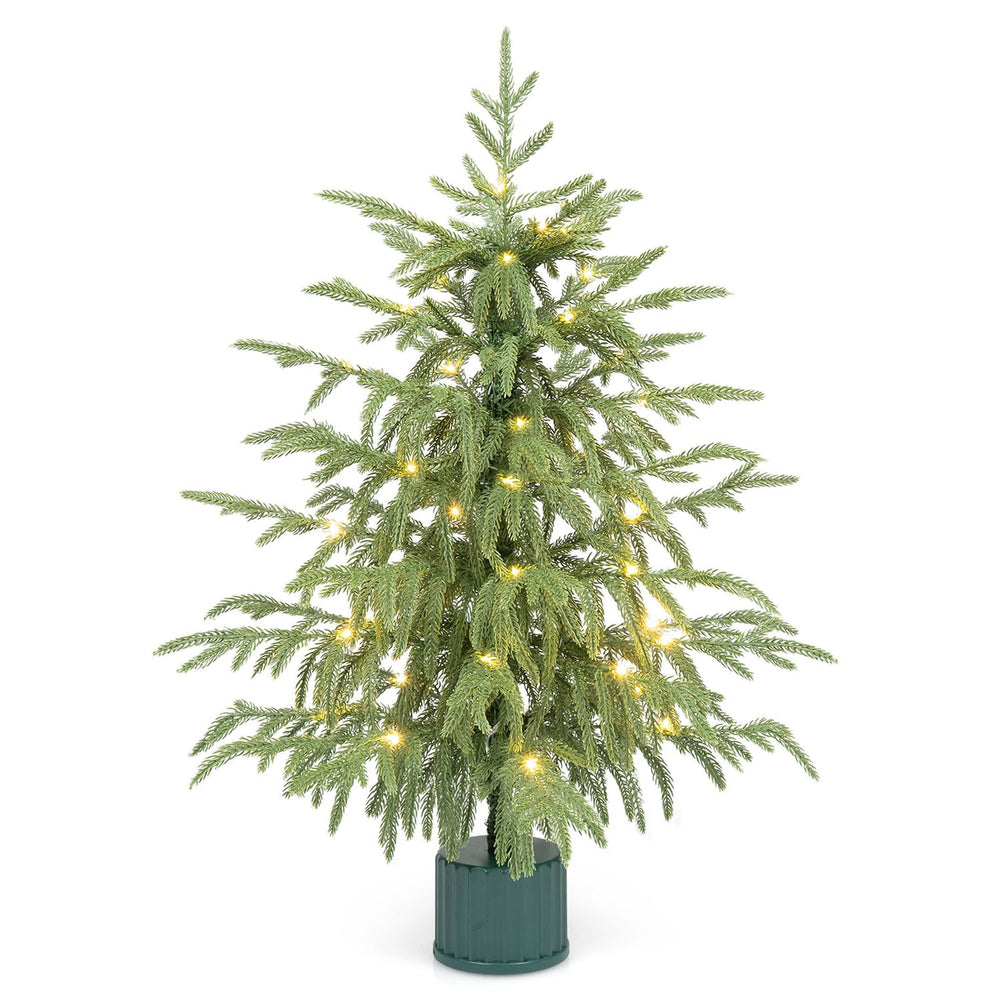 24" pre-lit tabletop Christmas tree with realistic PE branch tips, rotating musical base, and 35 warm white LED lights.