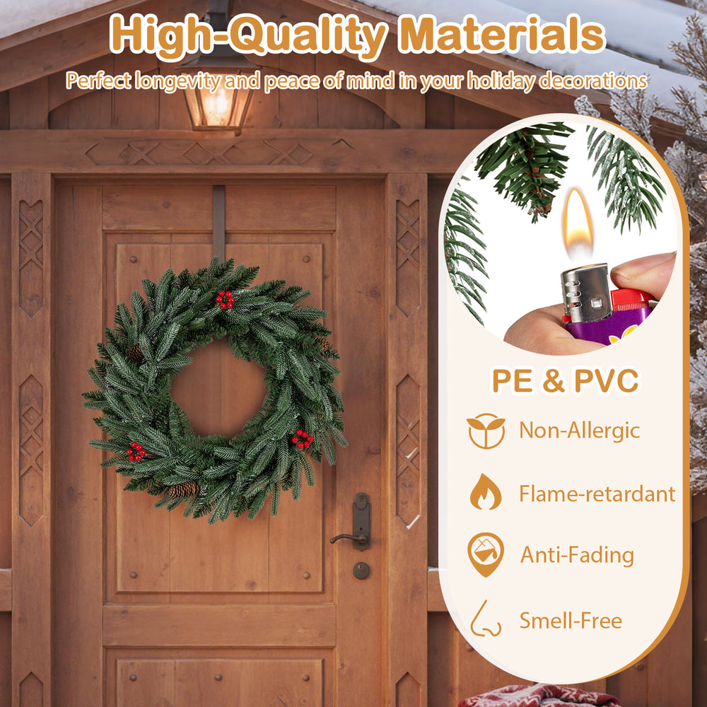 24” pre-lit Christmas wreath featuring 90 frosted branch tips, red berries, and warm white LED lights for festive decor.