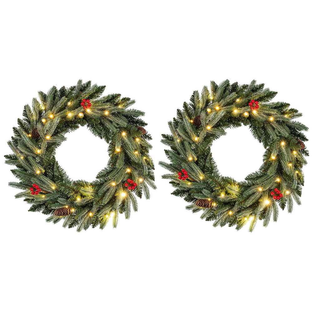 24” pre-lit Christmas wreath set of 2 with 90 frosted branch tips, red berries, pine cones, and warm white LED lights.