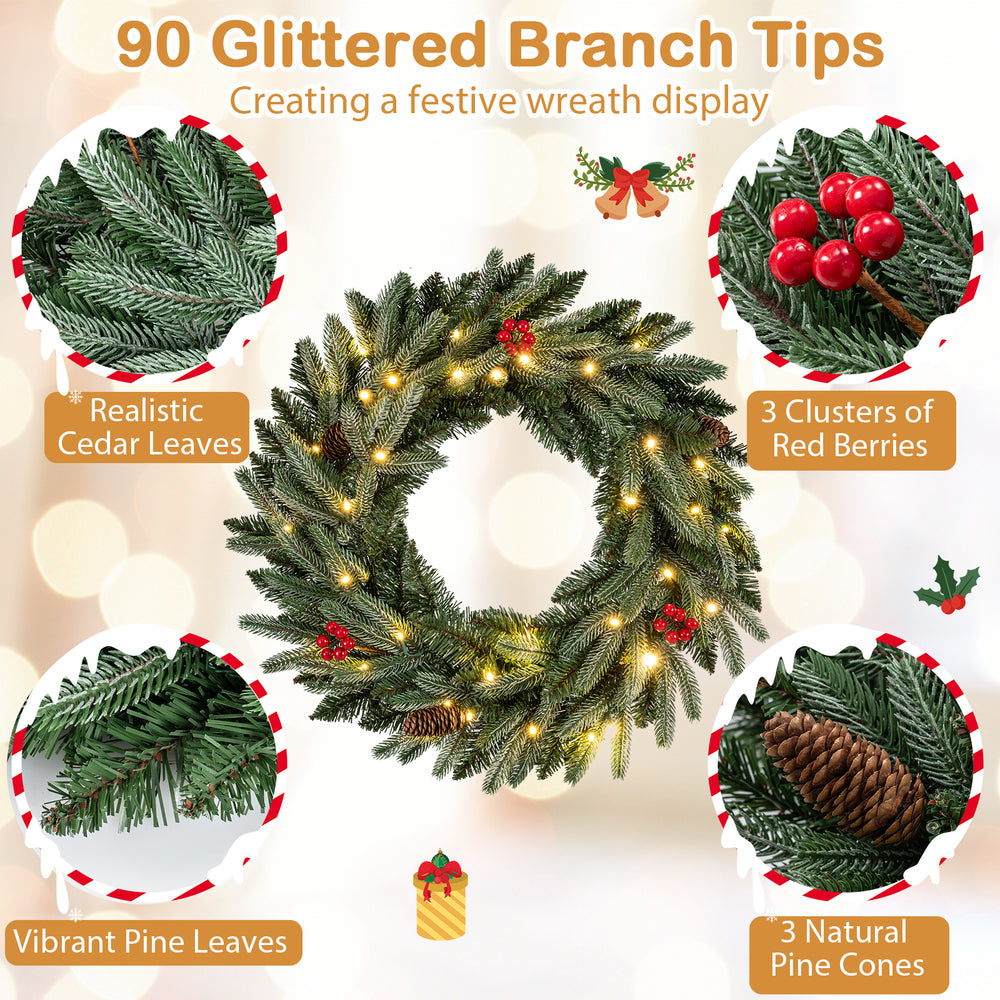 24” pre-lit Christmas wreath with 90 glittered branch tips, red berries, and natural pine cones for festive decor.