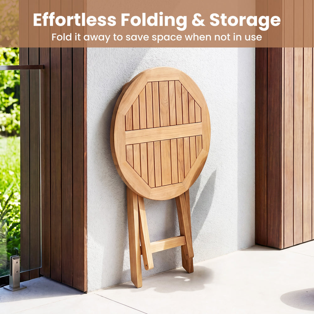 24" round solid teak outdoor folding bistro table with footrest, designed for space-saving storage on patios or.