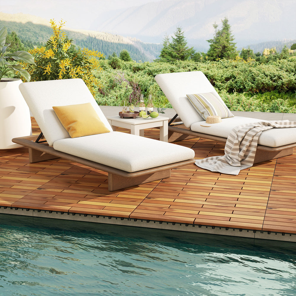 Acacia wood interlocking deck tiles in a natural finish, arranged on a patio by the pool for outdoor use.