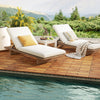 Acacia wood interlocking deck tiles arranged on a patio, ideal for outdoor use around pools and balconies.