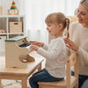 Kids playing with a 25 keys wooden piano keyboard toy with removable music stand, promoting creativity and music.