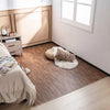 Brown wood grain foam floor mats with borders, arranged in a cozy bedroom setting for stylish flooring.