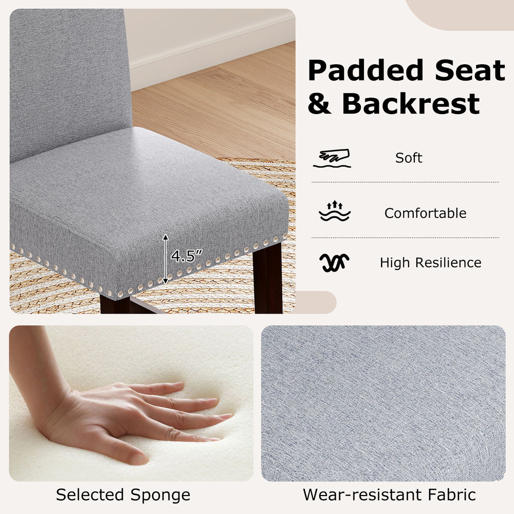 Gray padded seat and backrest chair with nailhead trim, designed for comfort and stability, ideal for counter height.