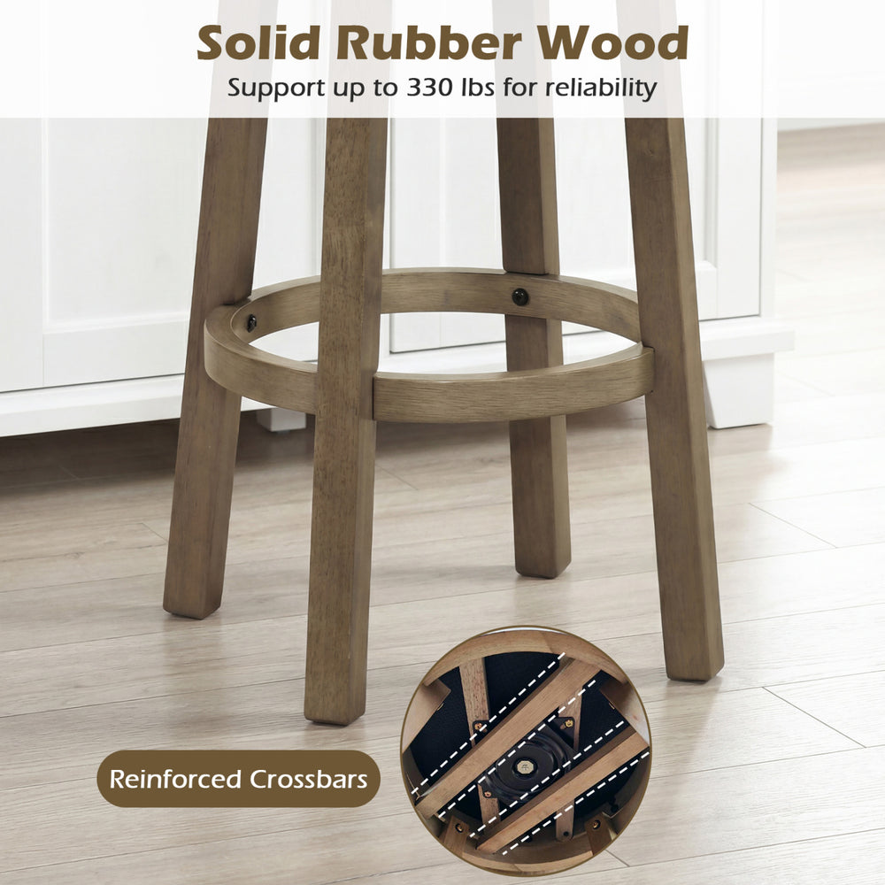 Close-up of solid rubber wood legs with reinforced crossbars, supporting the 27-inch swivel bar stool for durability.