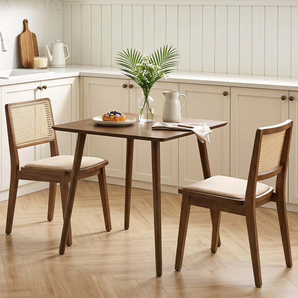 Small square walnut dining table for 2-4 people with rounded corners, solid rubber wood legs, and space-saving design.