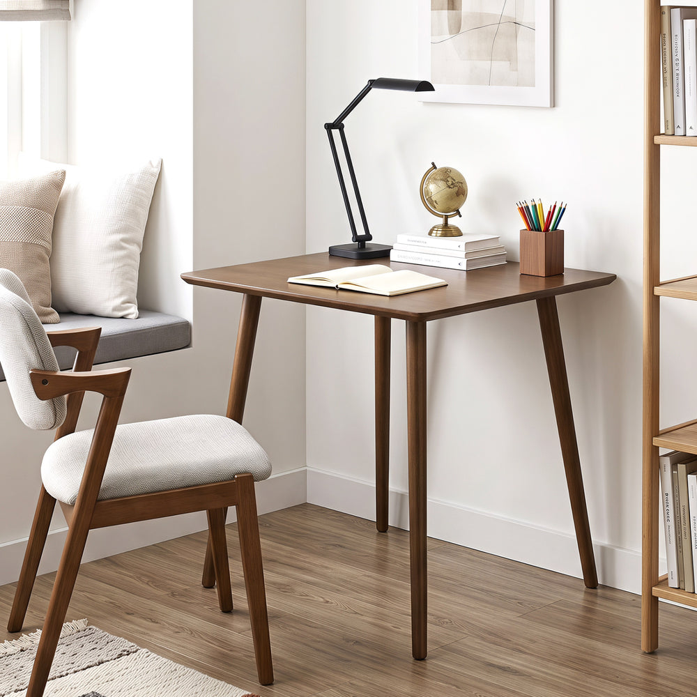 Small square walnut dining table seats 2 to 4 people, featuring rounded corners and solid rubber wood legs for stability.