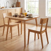 Natural bamboo dining table for 2-4 people, featuring a sturdy frame and mid-century style, perfect for compact spaces.