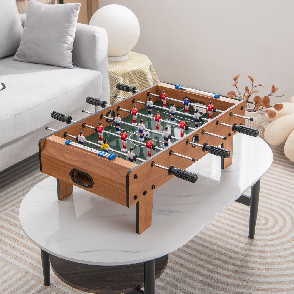 Mini 27-inch foosball table with ergonomic handles, perfect for tabletop soccer games at parties or group activities.