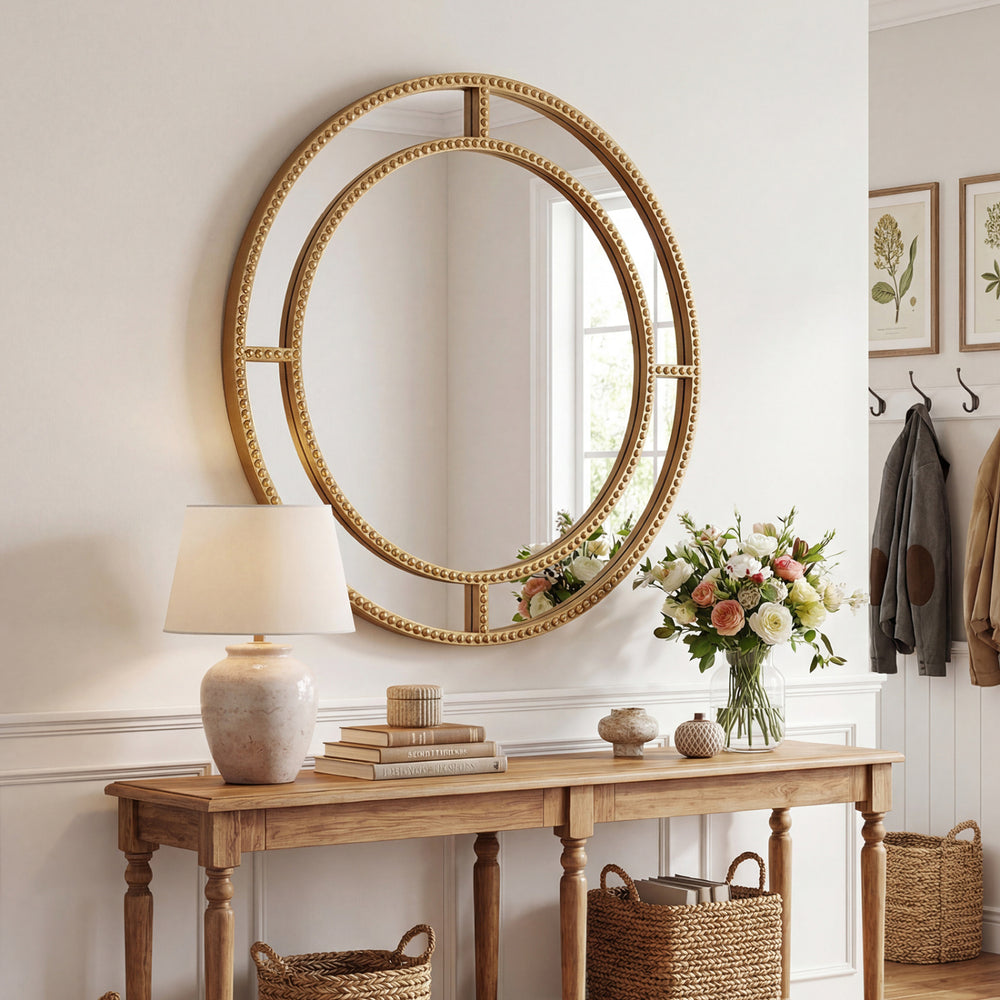 Gold round wall mirror with beaded frame, 28 inches, perfect for living room or entryway decor.
