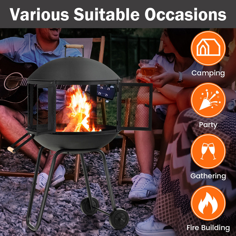 28-inch portable black fire pit on wheels with log grate, ideal for heating and barbecues at gatherings or parties.