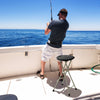 Portable folding stool with a sturdy frame, ideal for fishing, featuring a wide seat and footrests for comfort.