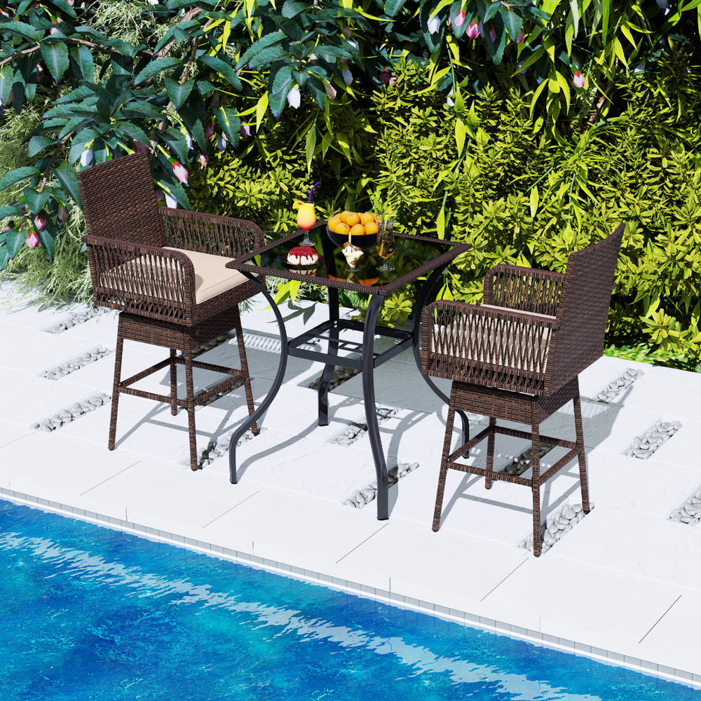 Brown PE rattan 29” bar height patio swivel bar stool with armrests and cushion, perfect for poolside relaxation.