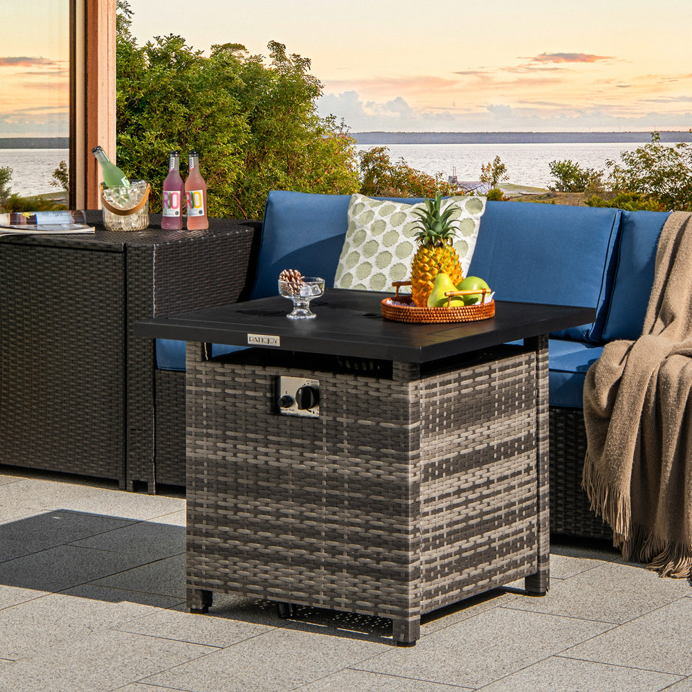 29-inch propane rattan firepit table in gray with lava rocks, transforming into a coffee table for versatile outdoor.